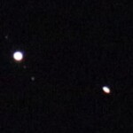 Photo I took of Jupiter and Saturn. Saturn is a flattened disk (rings) and some moons of Jupiter are visible.